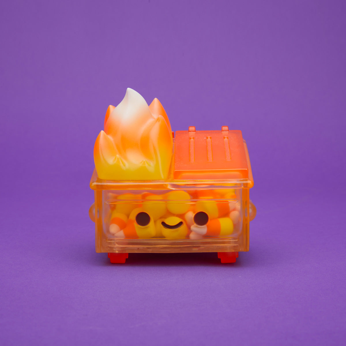 Orange translucent Dumpster Fire filled with candy corn and a yellow, orange, and white flame from the front.