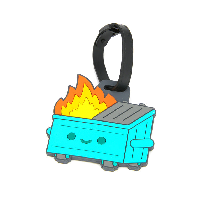 A rubber dumpster fire luggage tag hooked onto a black suitcase. 