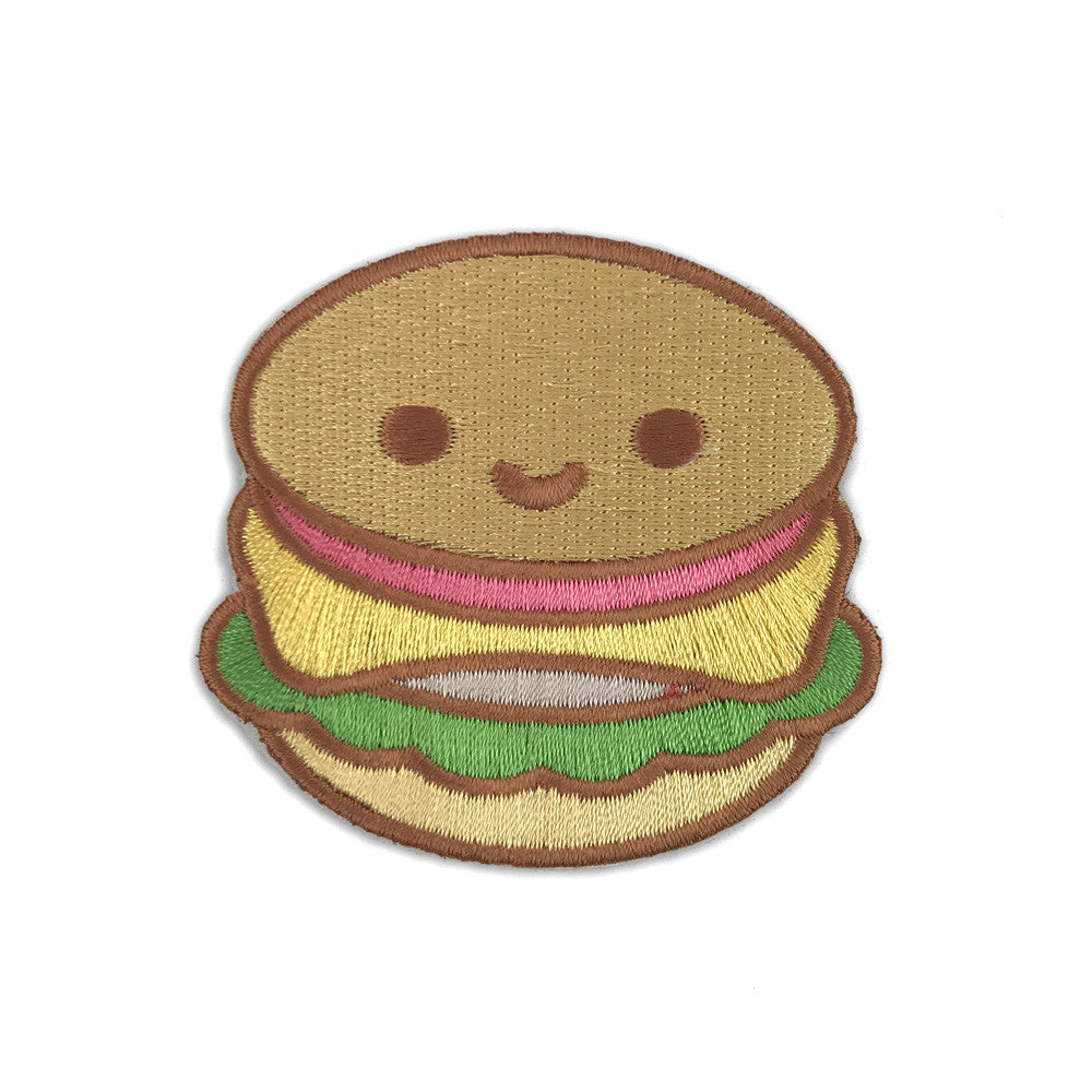 A patch of a burger on a white background.