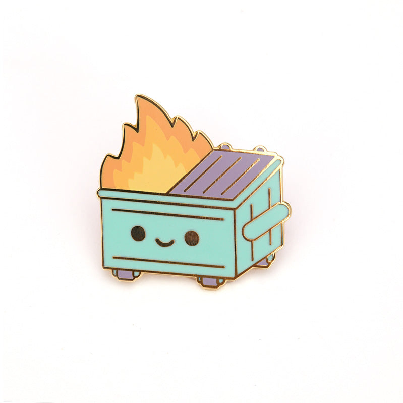 A pin of a pastel version of the green and orange dumpster fire on its card backing.